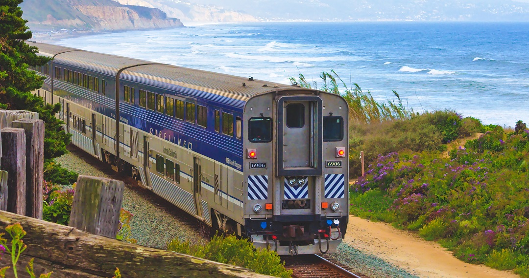 Blue train passing through the San Diego coast by Hari Panicker