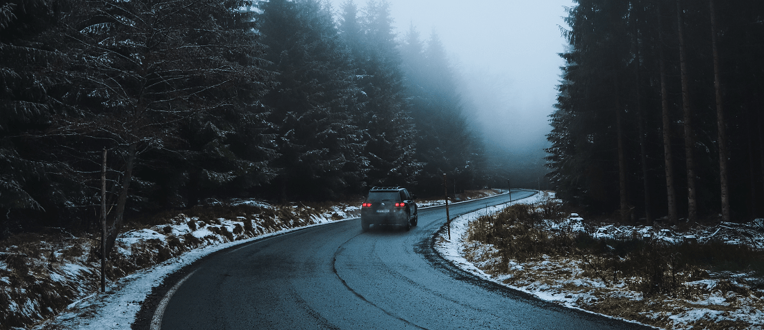 A car driving down a Czech forest road by Miroslav Škopek