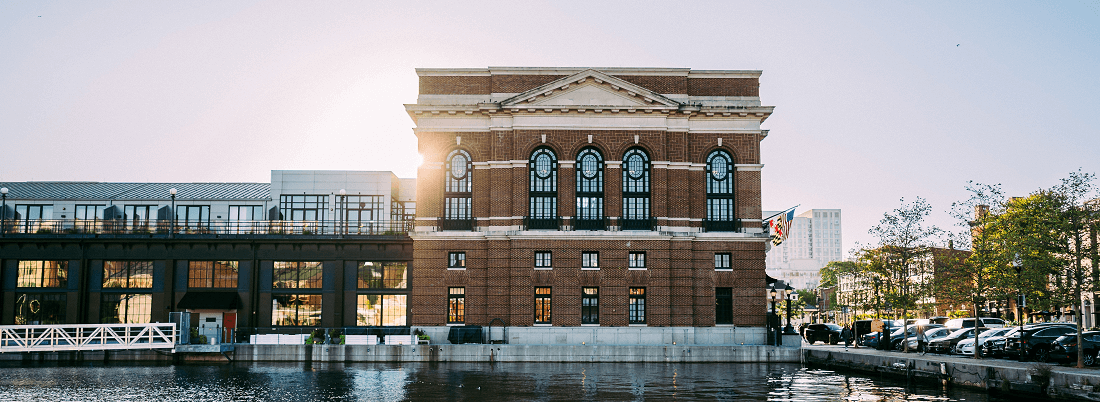 a large brick building sitting on the side of a river