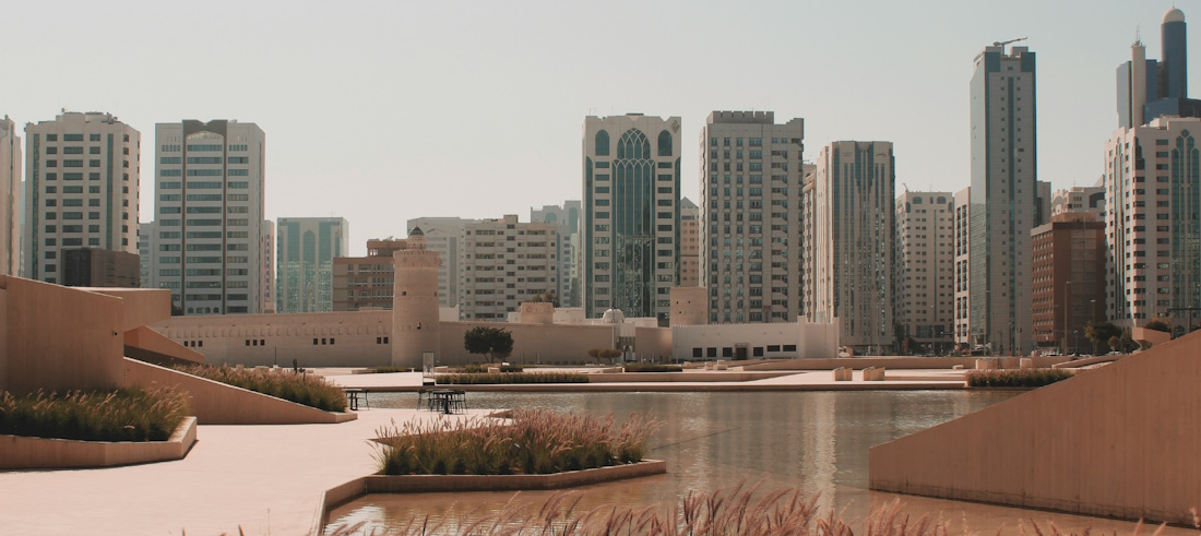 Medieval Arabic fort in front of Abu Dhabi skyscrapers