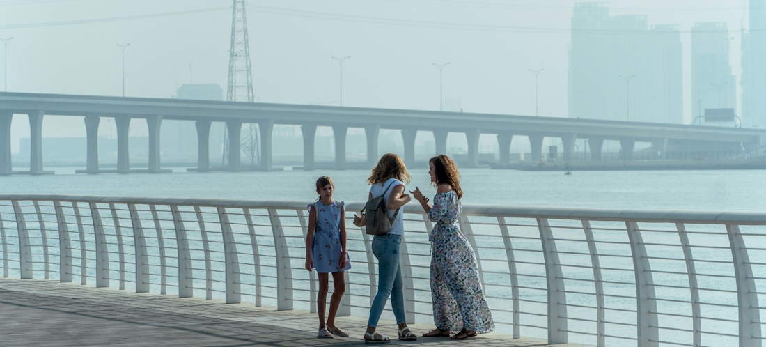 Tourists chatting on a waterfront in Abu Dhabi