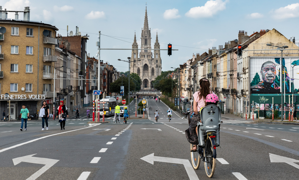 Mother and child on bicycle in Brussels by Werner Leeroy via Shutterstock.