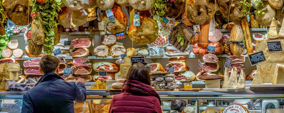 a display of meats and cheeses in a store