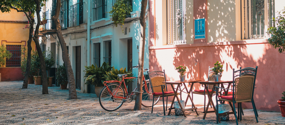 Bicycle and Cafe in Seville by Johan Mouchet on Unsplash