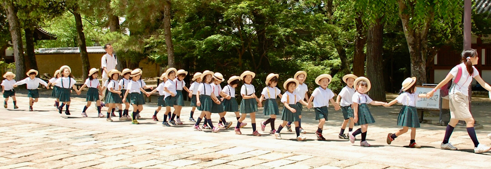 Schoolchildren in Japan by Lies Ouwerkerk via Shutterstock.