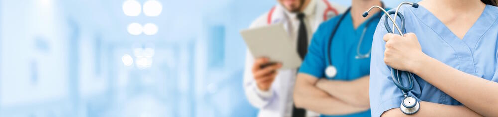 Banner of healthcare professionals standing in a hospital corridor