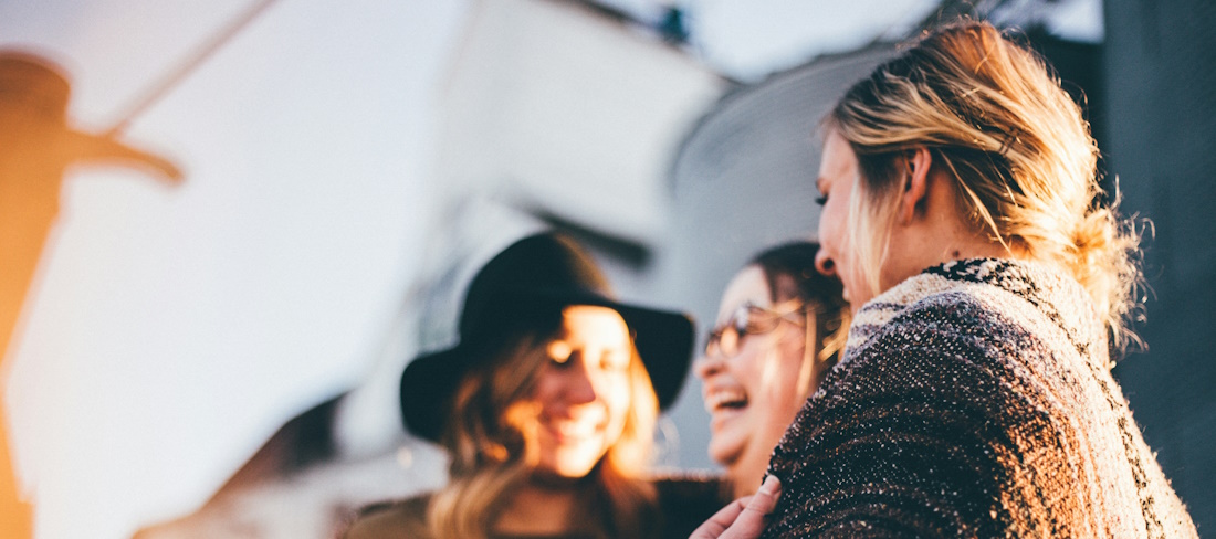 women laughing and talking