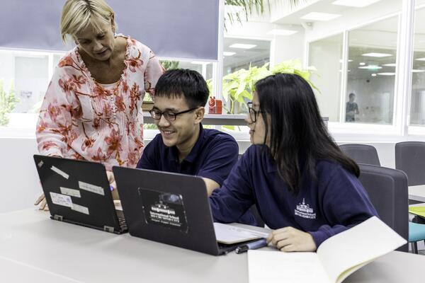 Teacher with two students