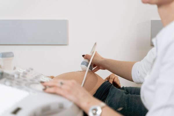 Pregnant woman doing a scan by Mart Production