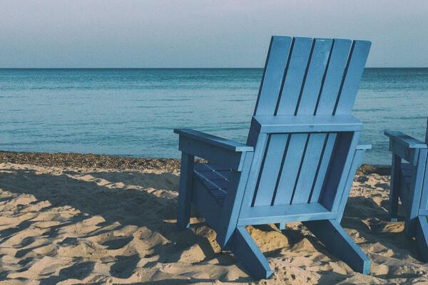 two recliner chairs on a peaceful beach